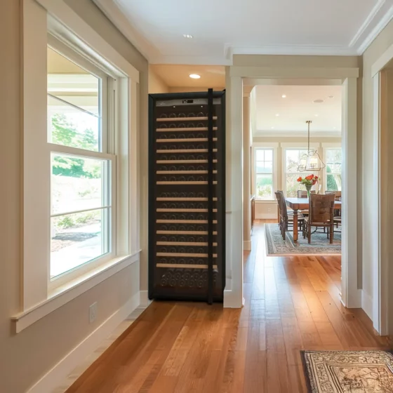 Design wine cellar big capacity black built in a kitchen with silver glass door in a design kitchen