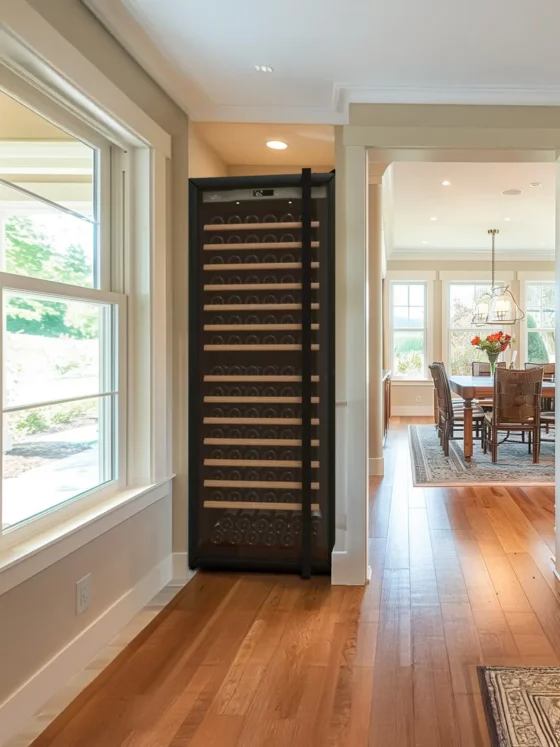 Design wine cellar big capacity black built in a kitchen with silver glass door in a design kitchen